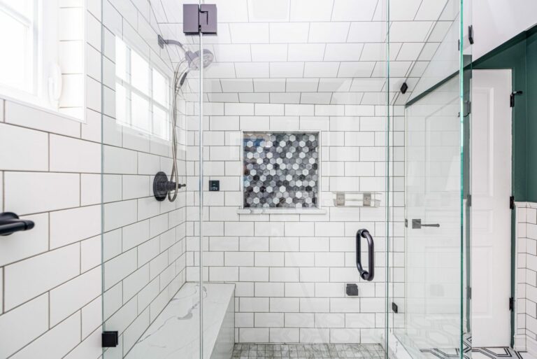 transformed tudor blue ridge master bathroom en suite marble mosaic floor frameless shower white black fixtures brizo subway tile mosic niche steam shower quartz bench